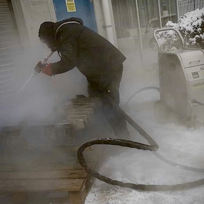 Dry ice blasting an electrical box