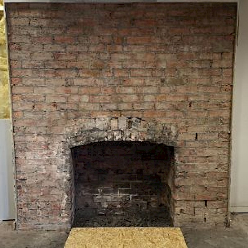 Before sandblasting brick fireplace.