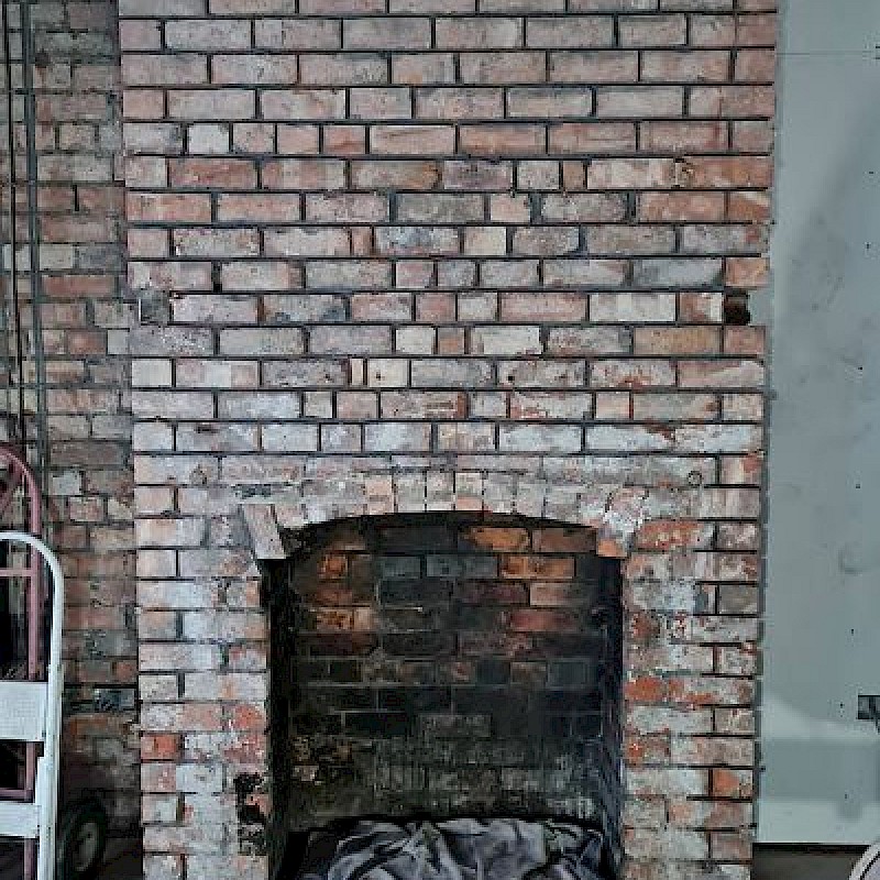 Before sandblasting brick fireplace.